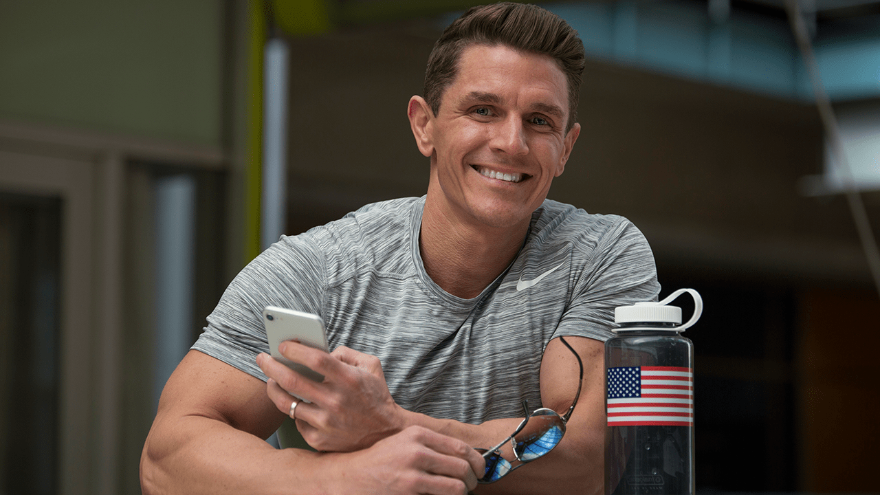 Jason Wittrock smiling in a grey t-shirt